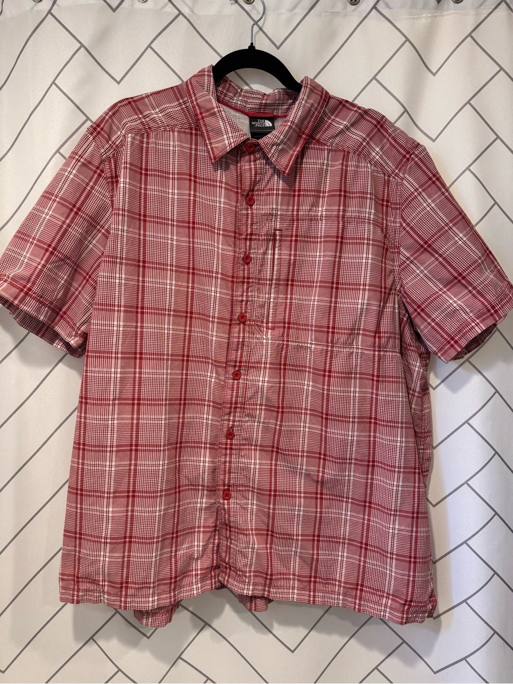 The North Face Red Plaid Short-Sleeve Button-Down Shirt with hidden zip pocket